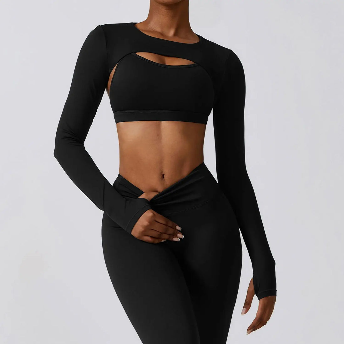 Detail view of the cropped top hemline and cutout front