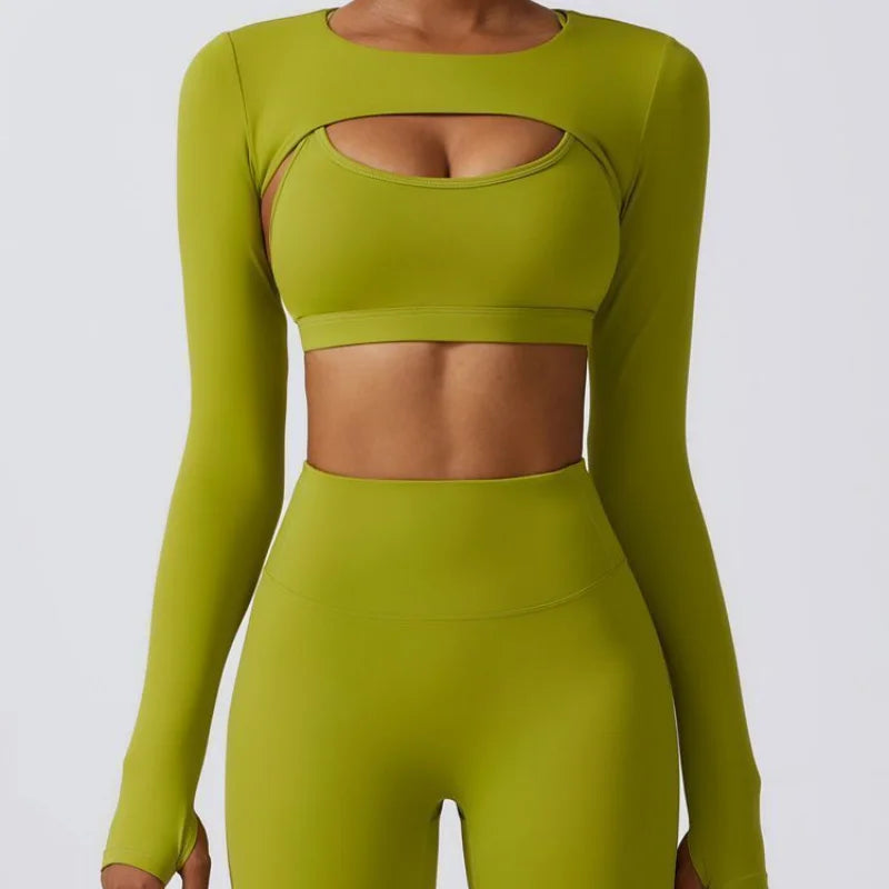 Woman wearing lime green long-sleeve cutout activewear set with matching high-waist leggings, front view