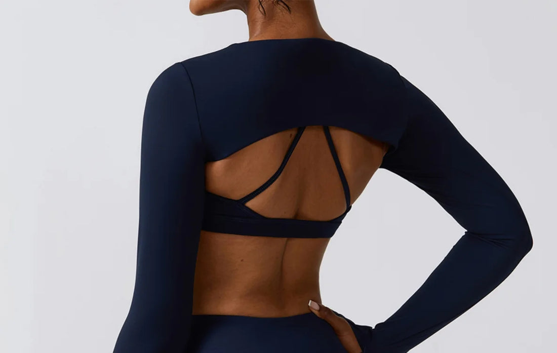 Long-sleeve cutout top and leggings set styled for athleisure wear