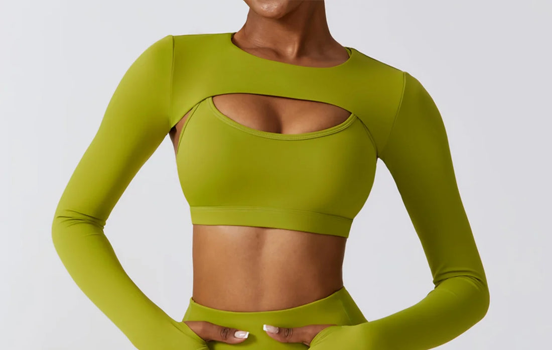 Woman doing a yoga pose wearing the long-sleeve cutout activewear set
