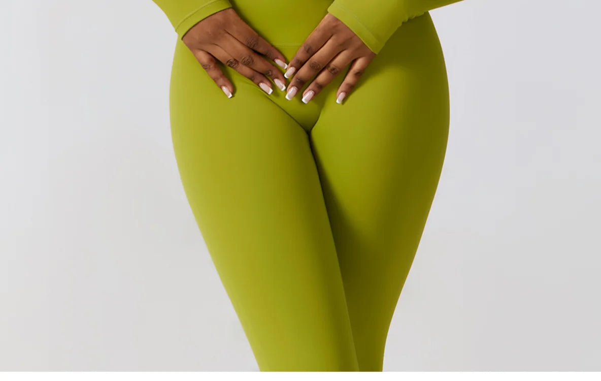 Side view of high-waist seamless leggings paired with long-sleeve cutout top